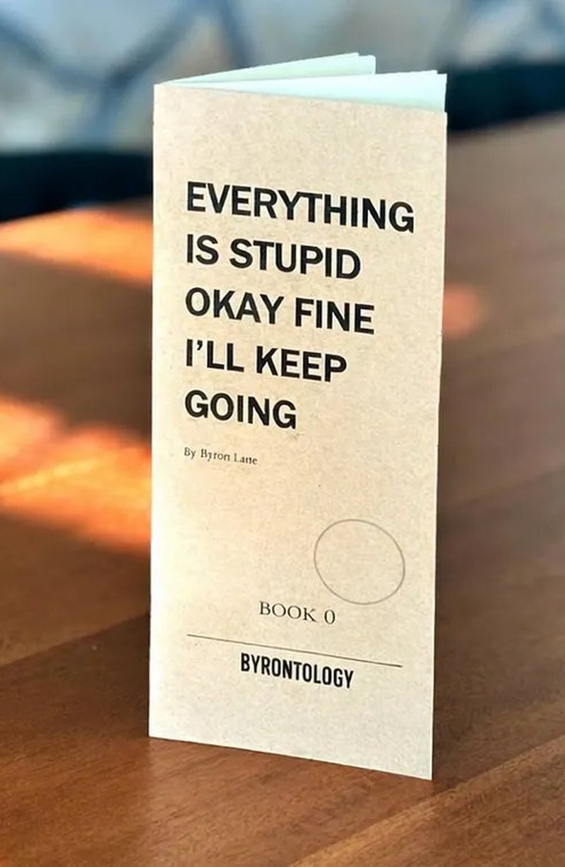 Byronbook 0: Everything Is Stupid Okay Fine I'll Keep Going, a handmade booklet on a table.